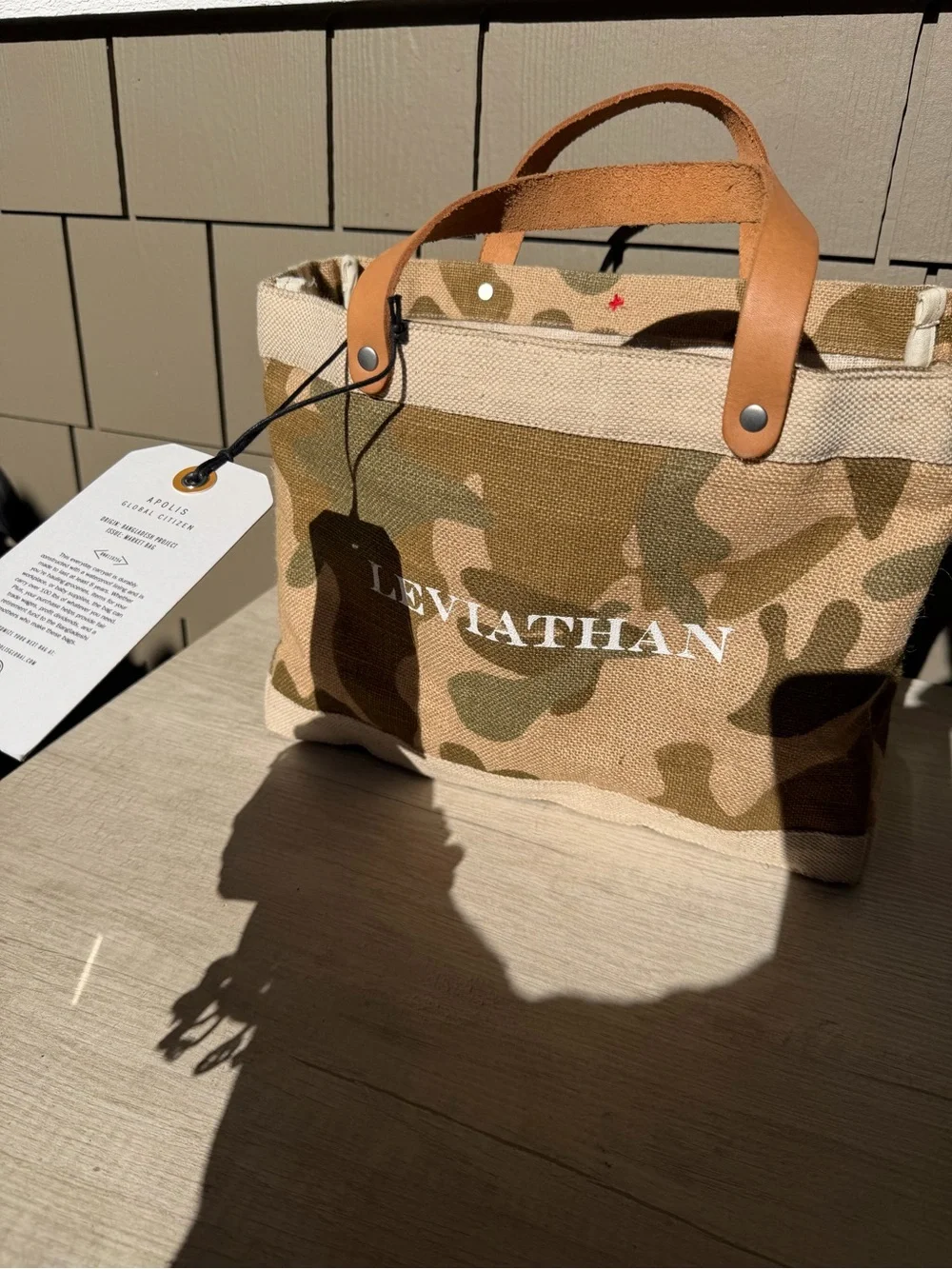 Apolis Global Citizen Market Bag in a safari camo print with tan leather handles